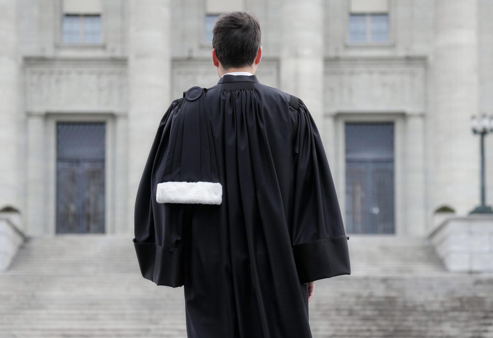 1001 Swiss Lawyer Standing In Front Of The Federal Supreme Court Of Switzerland Photo By Giles Laurent Scaled E1767864104652